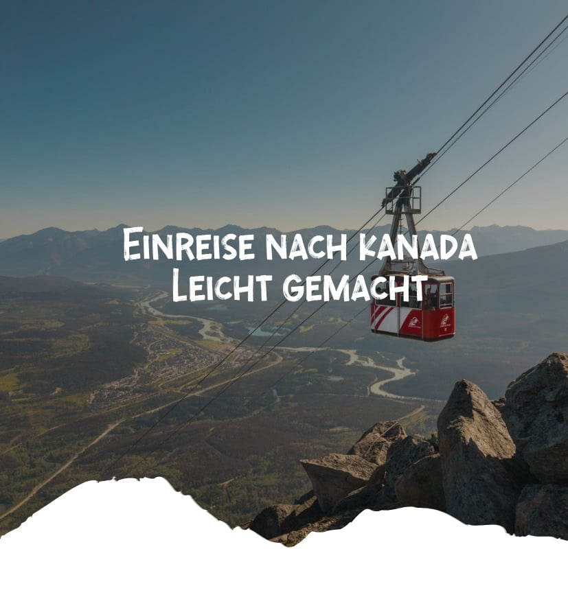 Eine rote Seilbahn fährt über eine Berglandschaft in Kanada mit Blick auf das Tal.
